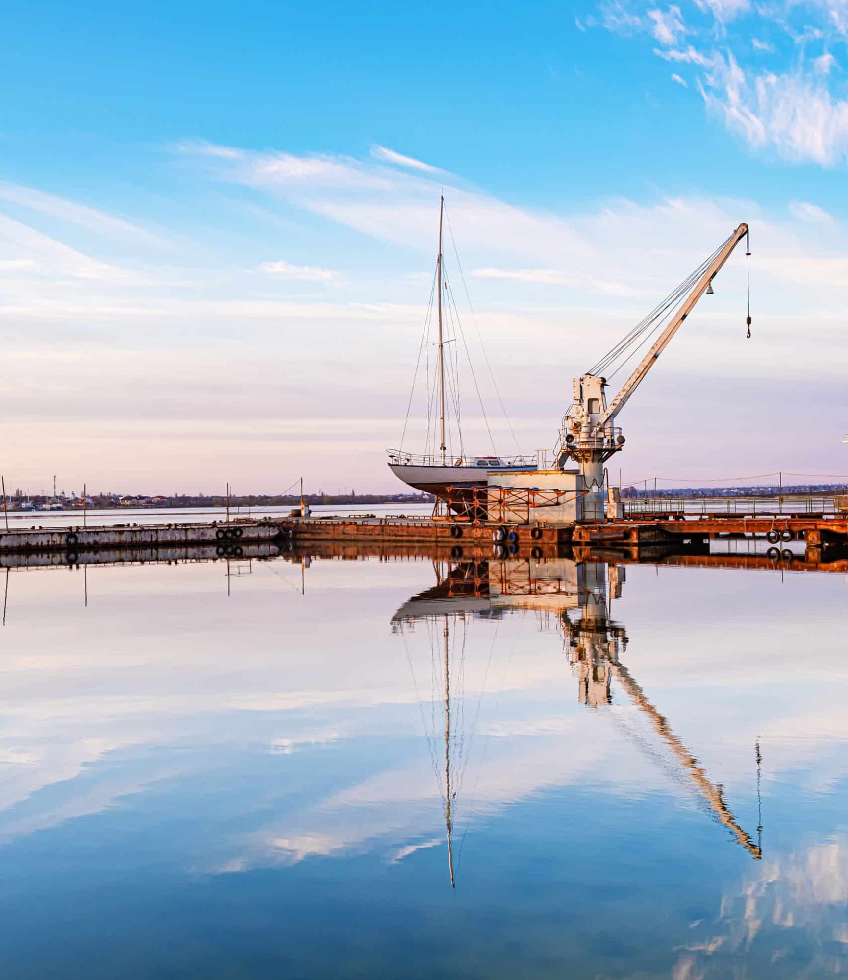 Small yacht under repair in an old dock